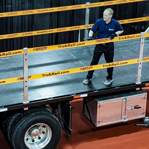 TrukRail.ca TrukRail protecting a worker on a flatbed truck.